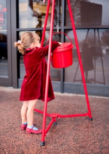Child Making a Donation